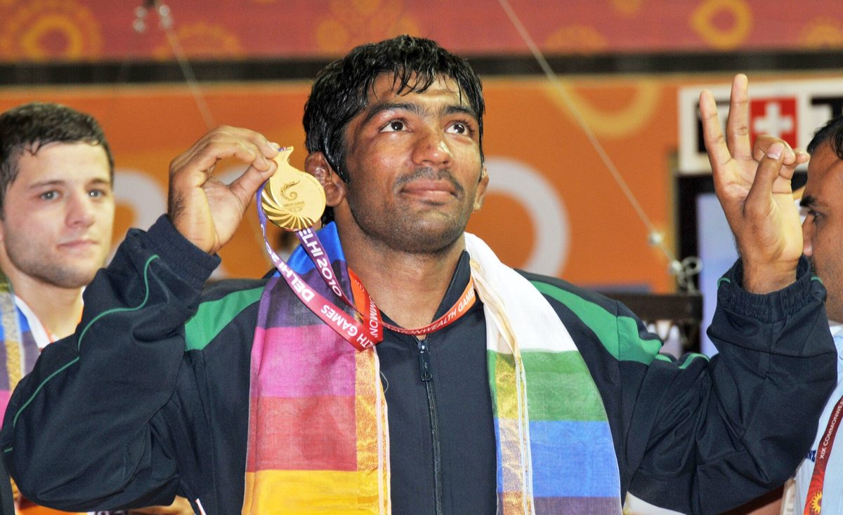 An Indian wrestler celebrating gold at the Indira Gandhi Stadium, Delhi 2010