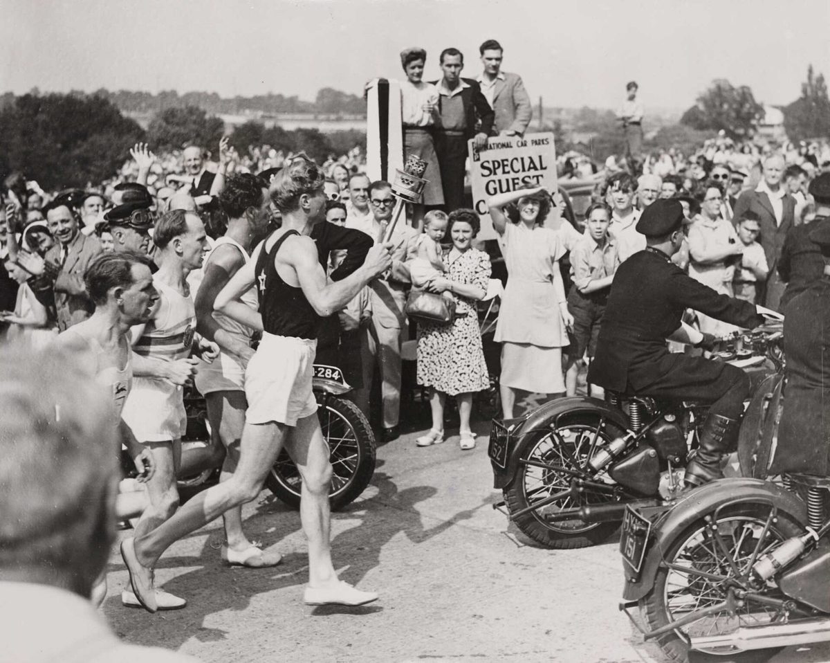 The Olympic torch arrives at Wembley Stadium, London 1948
